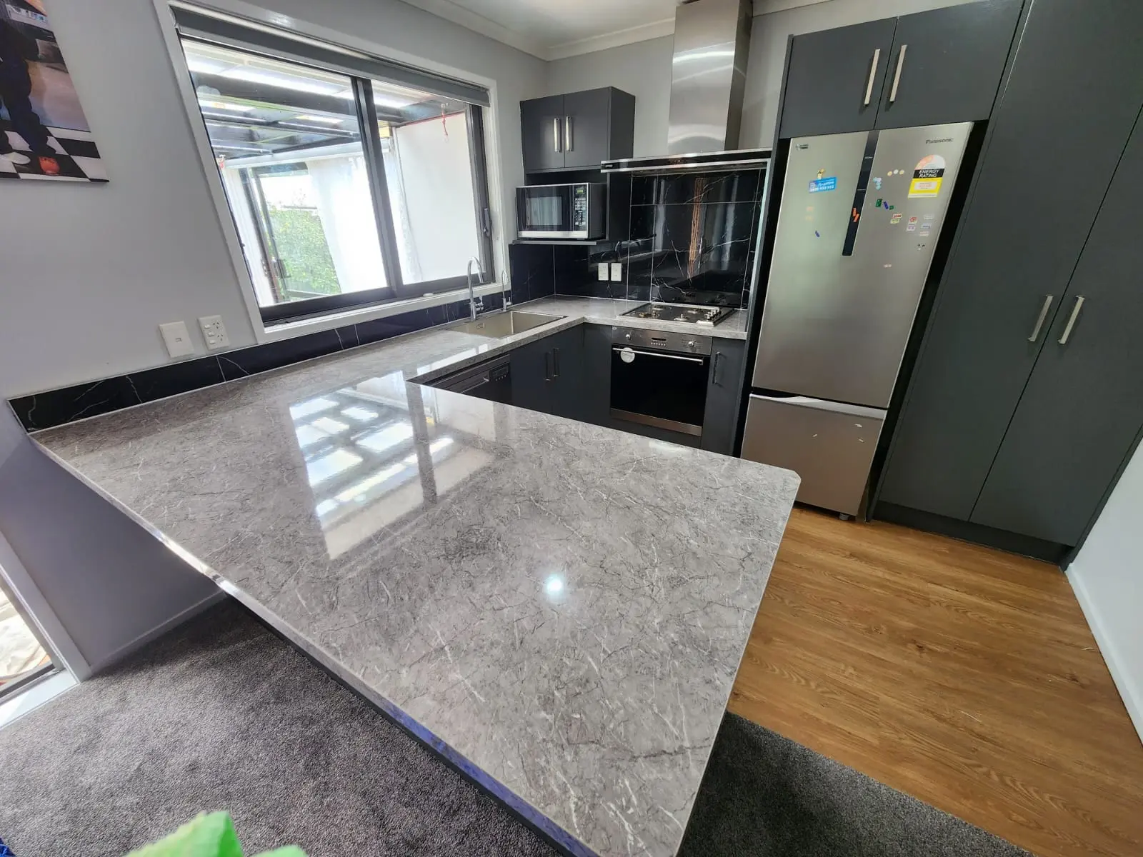 Contemporary kitchen upgrade with granite countertops and stainless steel appliances